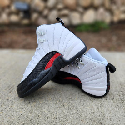 Jordan 12 black and white taxi hotsell