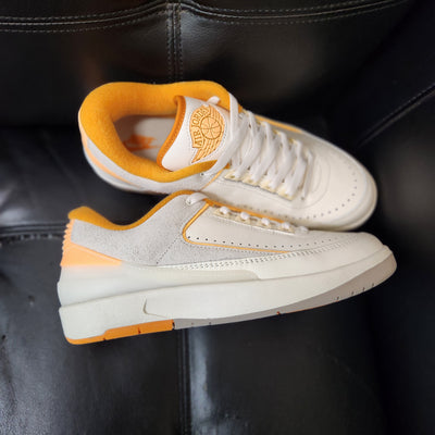 Air Jordan 2 Retro Low Craft Melon Tint sneakers with orange accents on tongue, heel, and outsole, SKU DV8759-600, release date